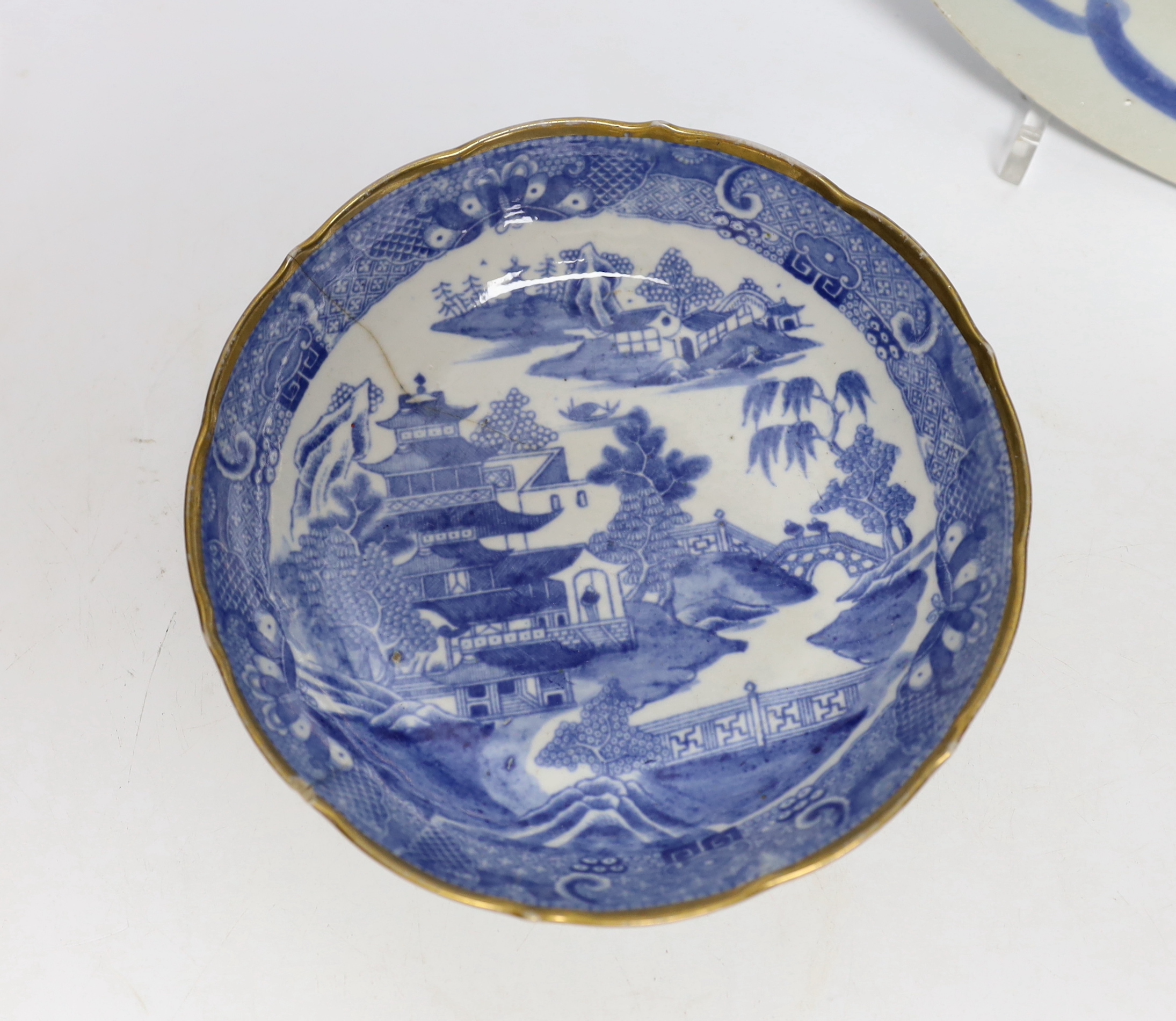 A Chinese famille rose teapot, a bowl and two dishes, bowl 24.5cm diameter